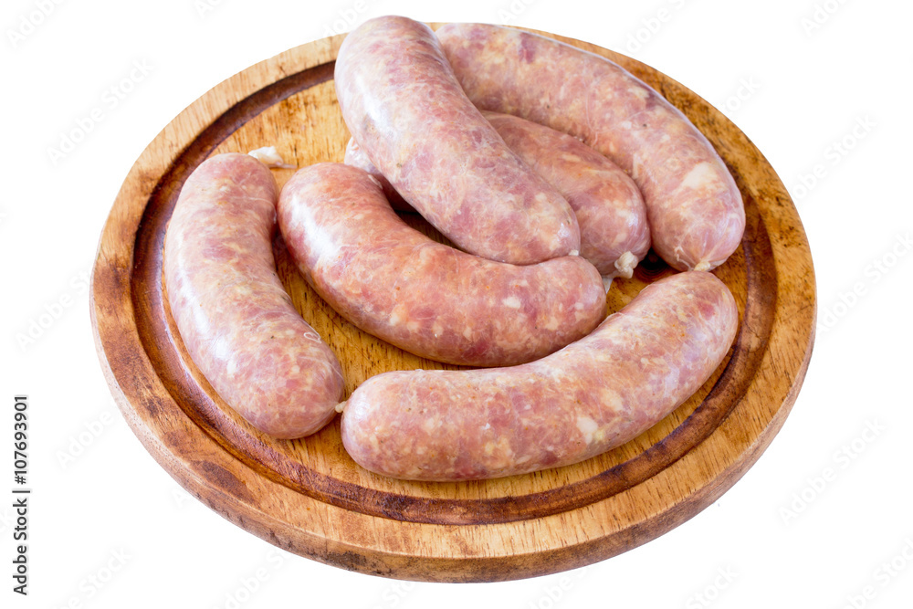 Homemade meat raw sausage on a wooden board