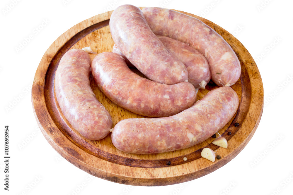 Homemade meat raw sausage on a wooden board Homemade meat raw sausage on a wooden board