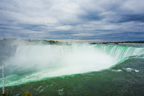 Fototapeta Naklejka Na Ścianę i Meble -  Summertime View of Niagara Falls from Ontario Canada Side