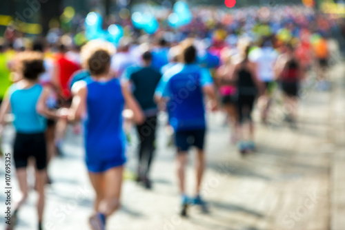 runners in marathon abstract, blurry   © Alextype