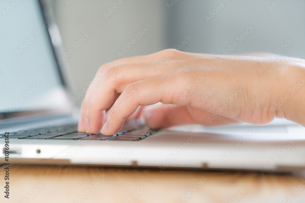 Closeup of business woman hand typing on laptop keyboard Closeup of business woman hand typing on laptop keyboard