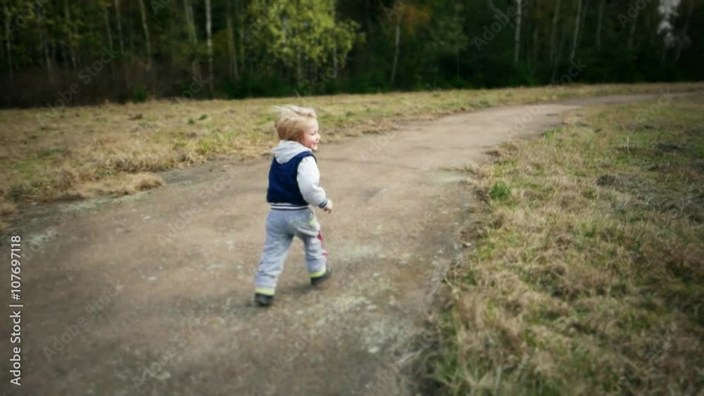 Child kid baby toddler boy is running, fun smiling Child kid baby toddler boy is running, fun smiling