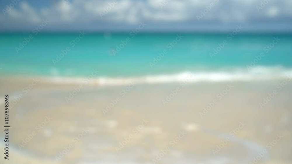 Fitness young woman checking activity tracker watch at beach. Runner is wearing turquoise colored smartwatch on sunny day. Determined female is in sportswear. Fitness young woman checking activity tracker watch at beach. Runner is wearing turquoise colored smartwatch on sunny day. Determined female is in sportswear.