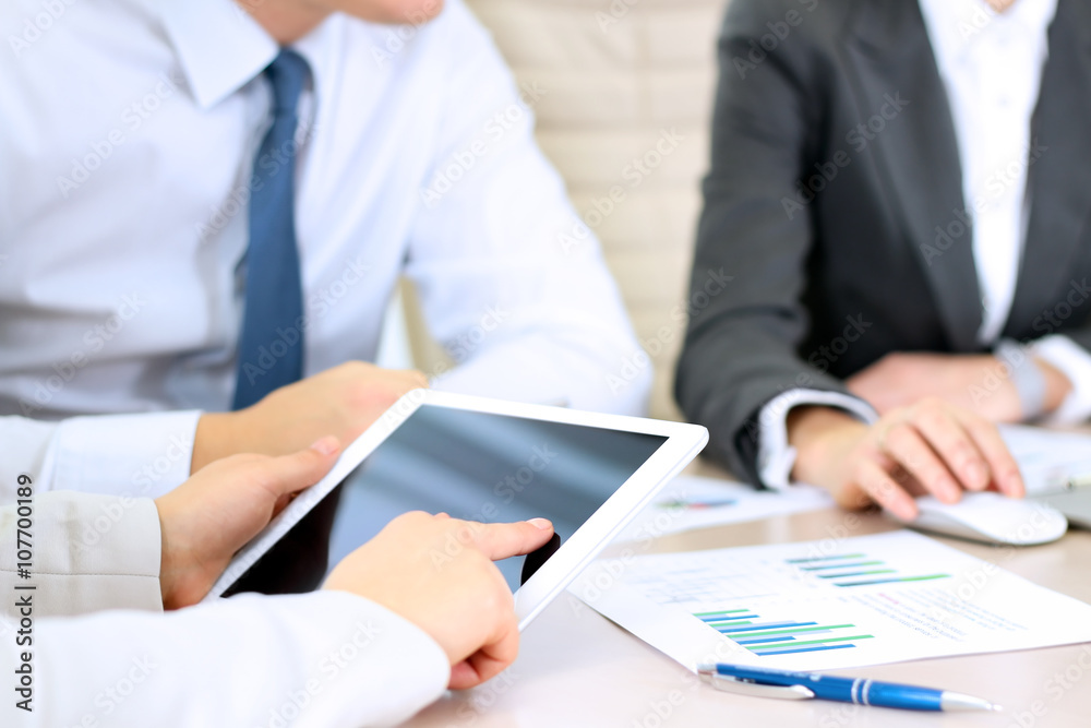 business colleagues working together and analyzing financial fig business colleagues working together and analyzing financial fig