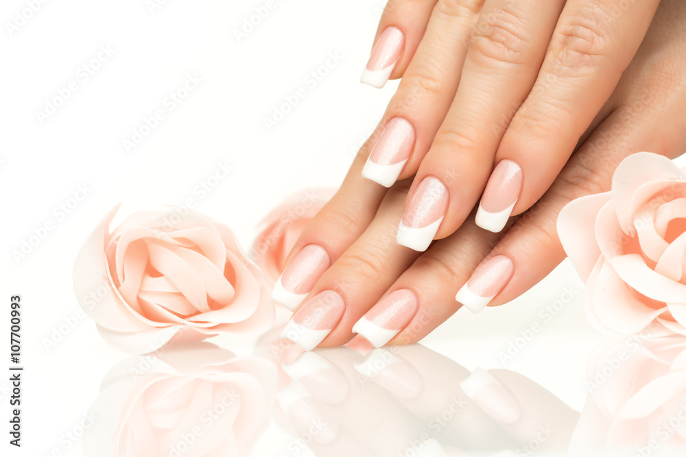 Woman hands with french manicure  close-up - obrazy, fototapety, plakaty 