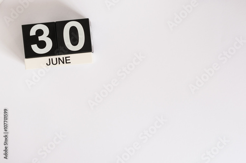 June 30th. Image of june 30 wooden color calendar on white background. Summer day. Empty space for text