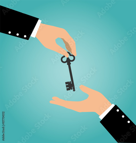 Business hand giving a house key to another hand