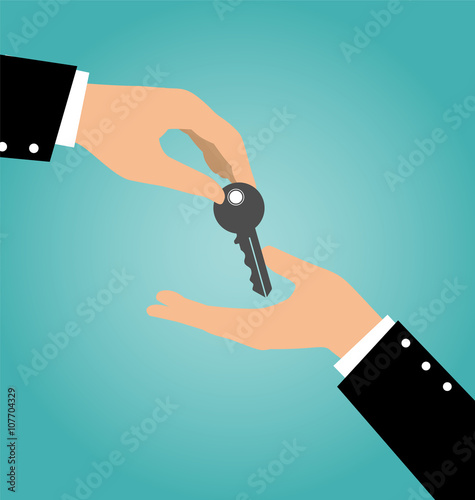 Business hand giving a key to another hand