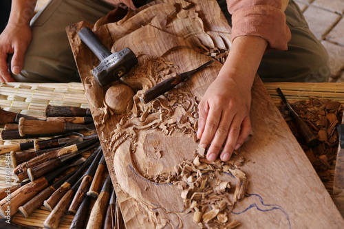 craftsman carving wood photo