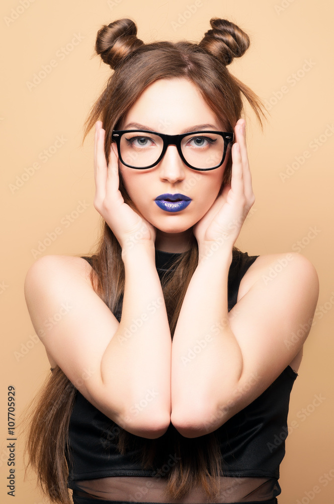 Beautiful young woman in glasses