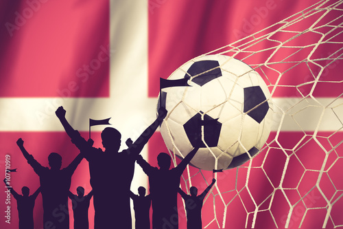 silhouettes of Soccer fans with flag of Denmark .Cheer Concept v