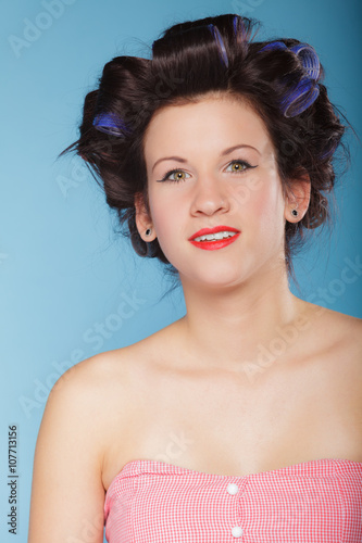 girl with curlers in hair, woman preparing to party.