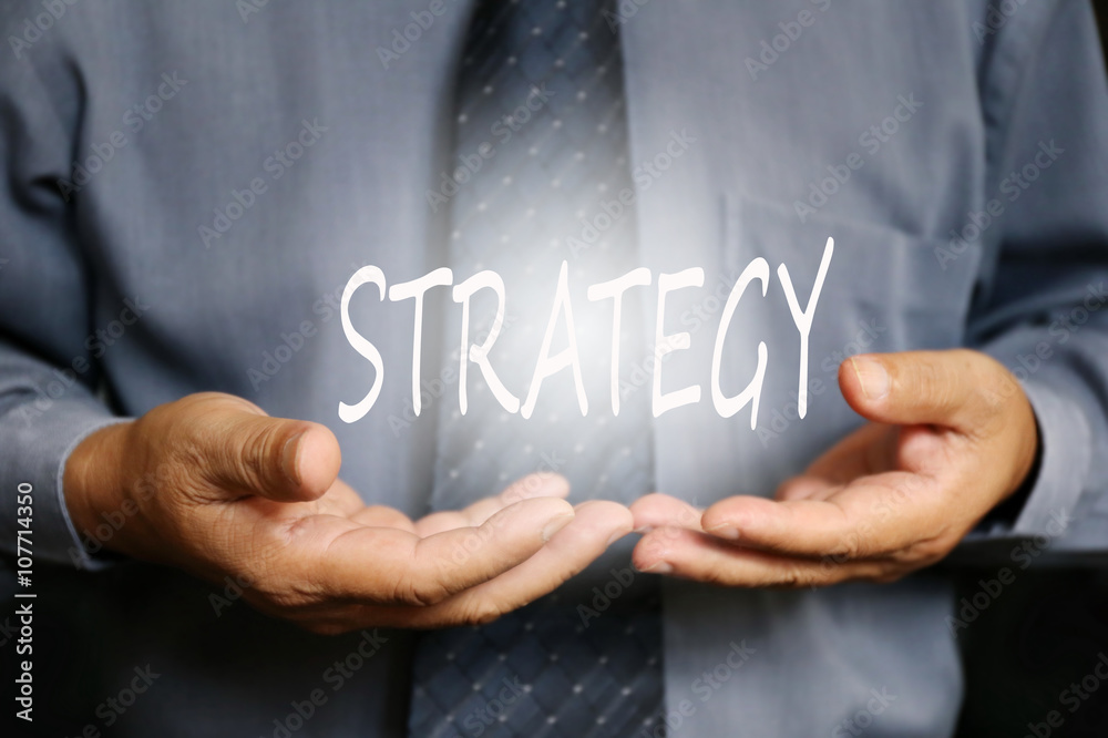 Strategy word on hand, businessman Strategy word on hand, businessman