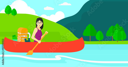 Woman canoeing on the river.