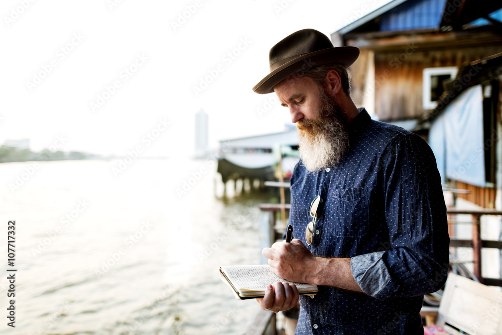 Fototapeta premium Man Journal Exploring Tourism Concept