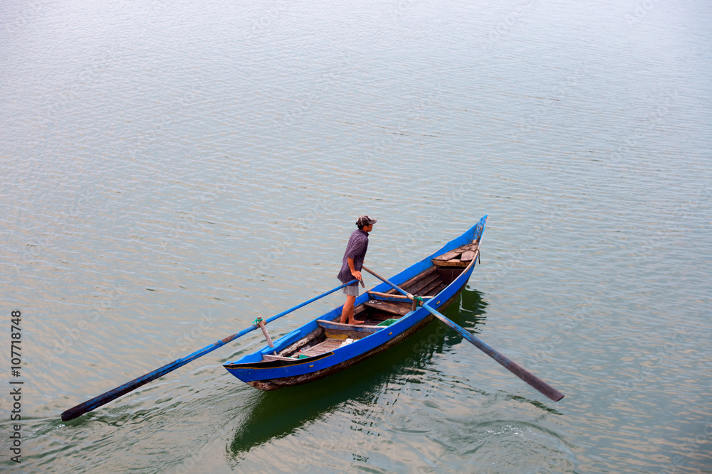 Fisher man come home in O Loan lagoon, Phu Yen, Vietnam