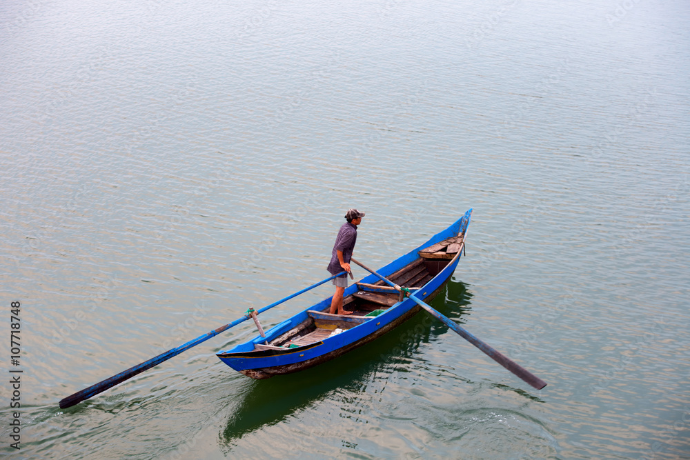 Fisher man come home in O Loan lagoon, Phu Yen, Vietnam Fisher man come home in O Loan lagoon, Phu Yen, Vietnam