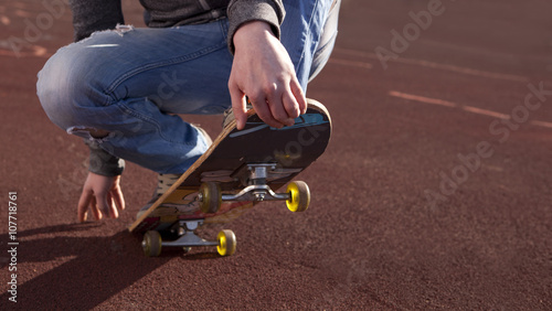 Teenager doing exercises on a skateboard © Andrey Burmakin