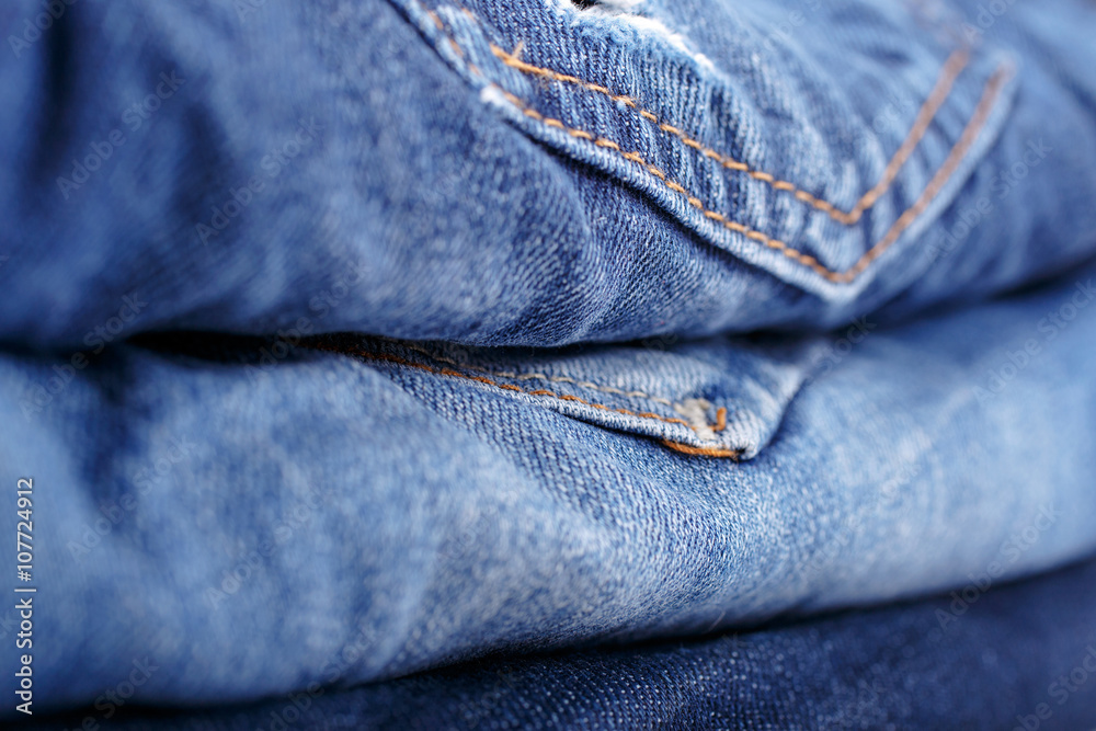 Fototapeta premium Stack blue jeans closeup