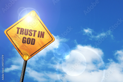 Yellow road sign with a blue sky and white clouds: trust in god