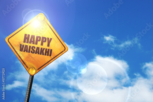 Yellow road sign with a blue sky and white clouds: happy vaisakh photo