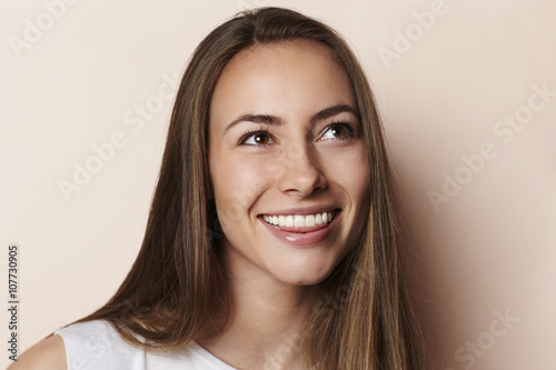 Beautiful young model smiling in studio