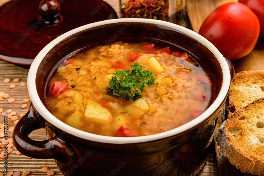 Red lentil soup on wooden table. Red lentil soup on wooden table.