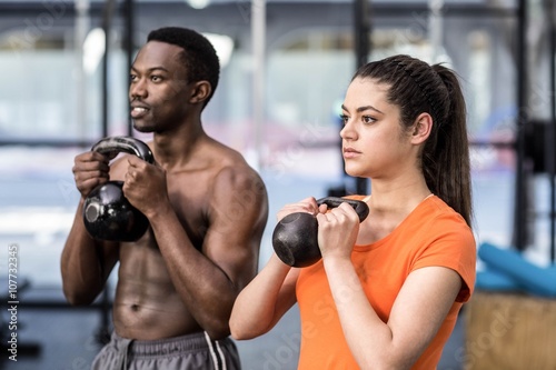 Athletic man and woman working out