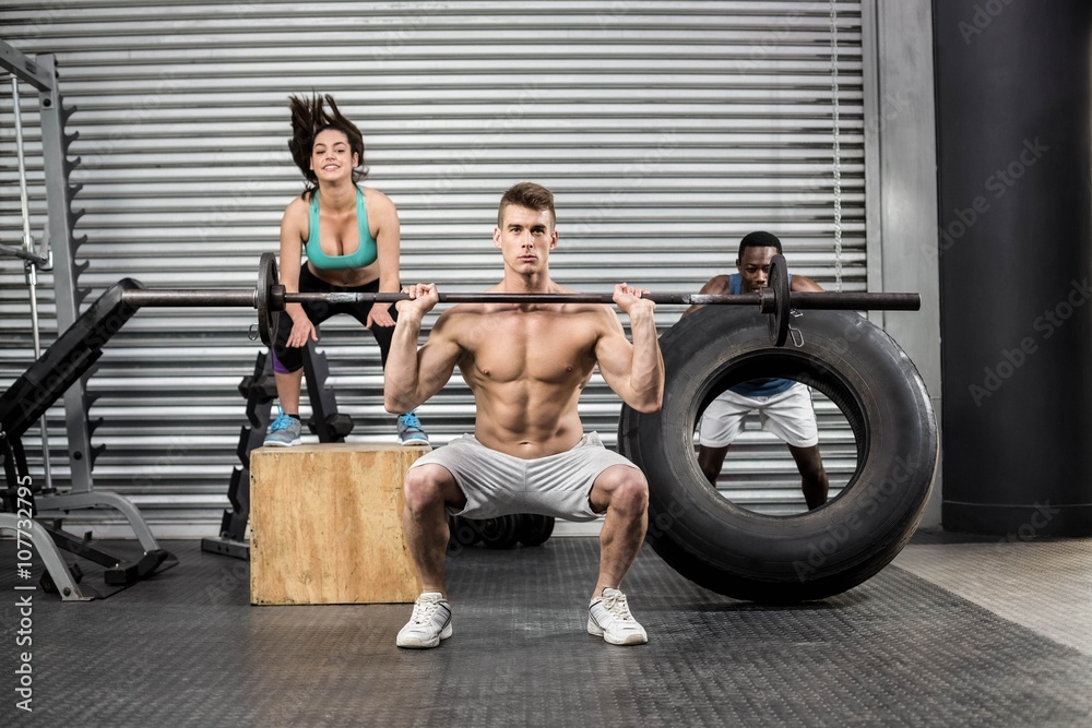 Naklejka premium Fit people exercising together