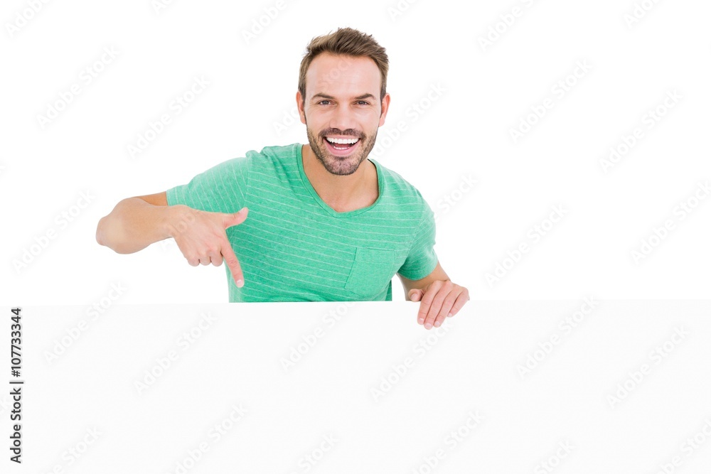 Happy young man showing white board Happy young man showing white board