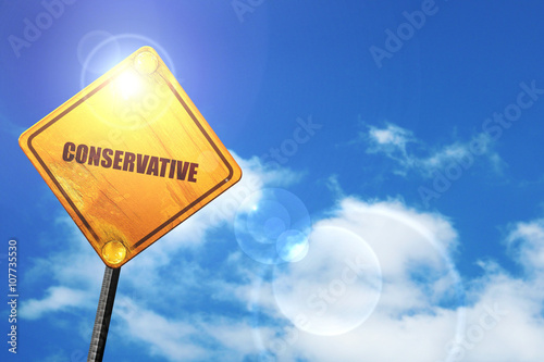 Foto Yellow road sign with a blue sky and white clouds: conservative