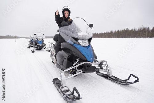 Woman on a snowmobile