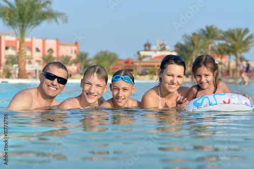 Family relax in the pool