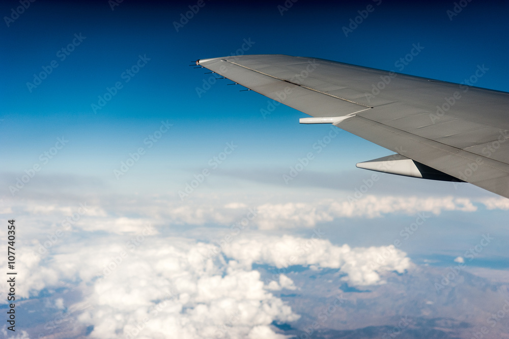under wing, the clouds, view from window under wing, the clouds, view from window