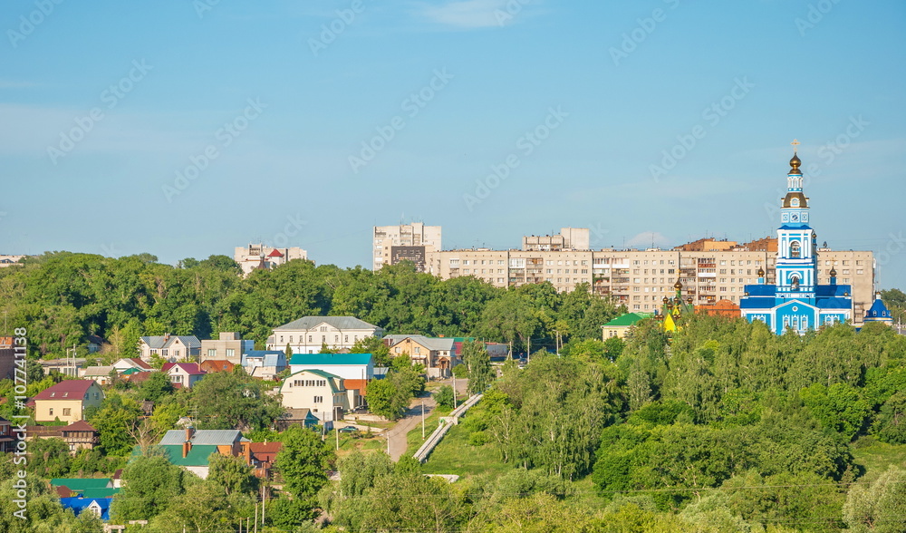 Urban provincial landscape with park, houses and temple