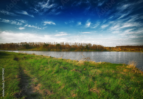 Sunny day on a calm river in summer