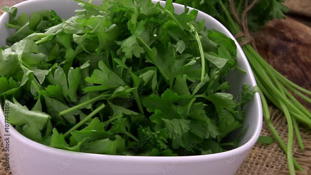 Portion of fresh cutted rotating Parsley as not loopable 4K UHD footage Portion of fresh cutted rotating Parsley as not loopable 4K UHD footage