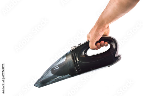 Hand hold vacuum cleaner on white background