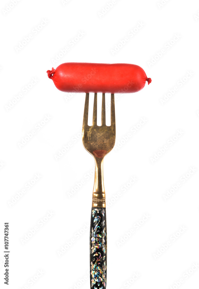 Sausage, prick with a fork on white background