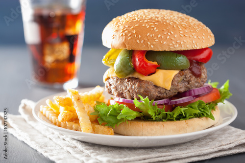 homemade cheese burger with peppers tomato onion