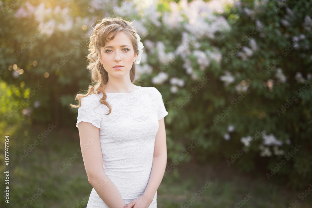 Charming woman with wavy hair and white dress Charming woman with wavy hair and white dress