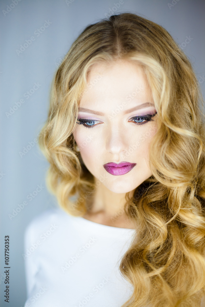 Portrait of beautiful young blond woman with clean face .Close up beauty portrait of young model with clean fresh skin and professional makeup. Portrait of beautiful young blond woman with clean face .Close up beauty portrait of young model with clean fresh skin and professional makeup.