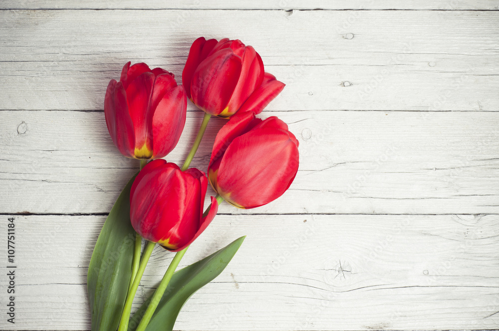 tulips in a vase on white background isolated