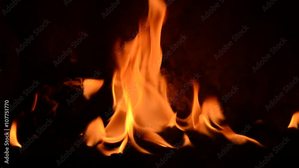 Close up of fire in furnace with black frame shot askance Close up of fire in furnace with black frame shot askance