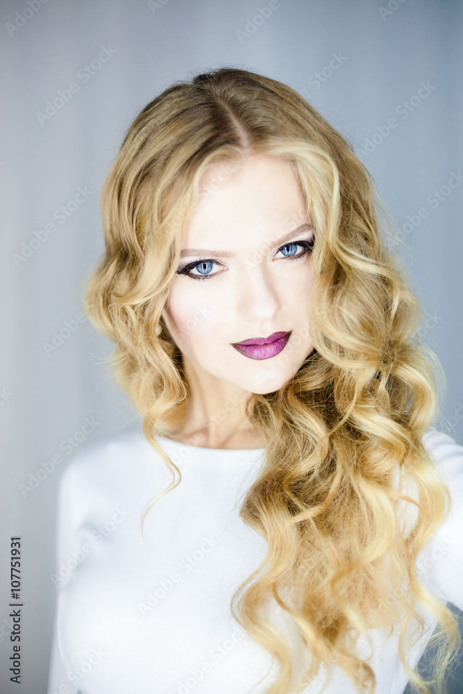 Portrait of beautiful young blond woman with clean face .Close up beauty portrait of young model with clean fresh skin and professional makeup. Portrait of beautiful young blond woman with clean face .Close up beauty portrait of young model with clean fresh skin and professional makeup.