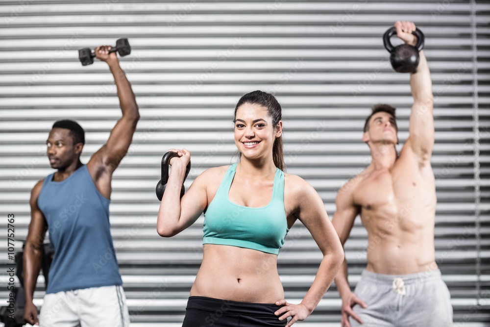 Naklejka premium Fit people lifting dumbbells