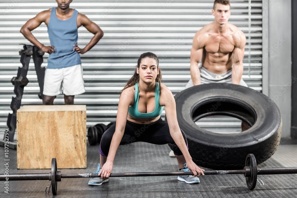 Naklejka premium Fit people exercising together