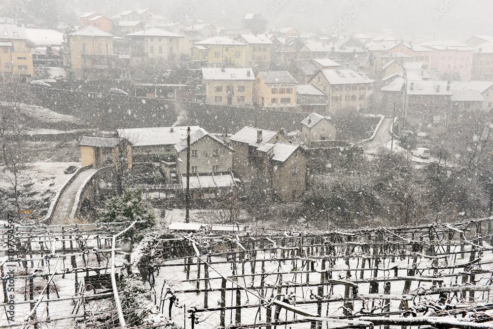 The village of Giornico under snowfall in Leventina valley