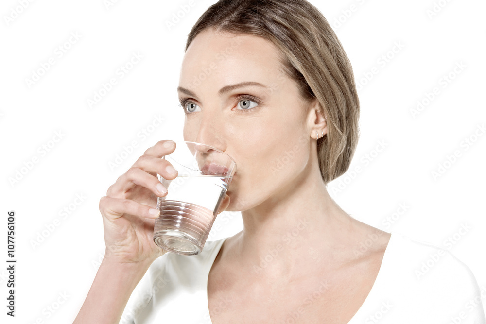Young Caucasian woman drinking a glass of water Young Caucasian woman drinking a glass of water
