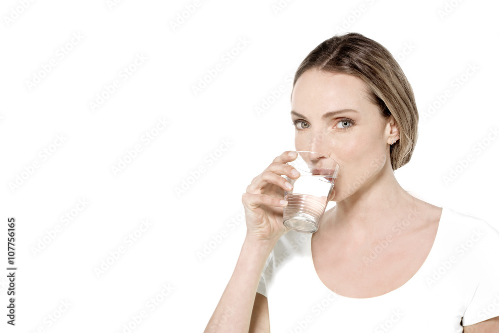 Portrait of a young Caucasian woman drinking a glass of water Portrait of a young Caucasian woman drinking a glass of water